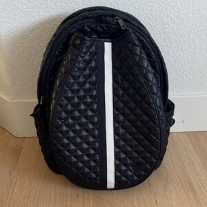 Oliver Thomas black quilted tennis backpack with white stripe